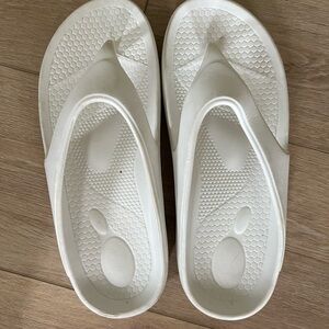 White trendy flip flops